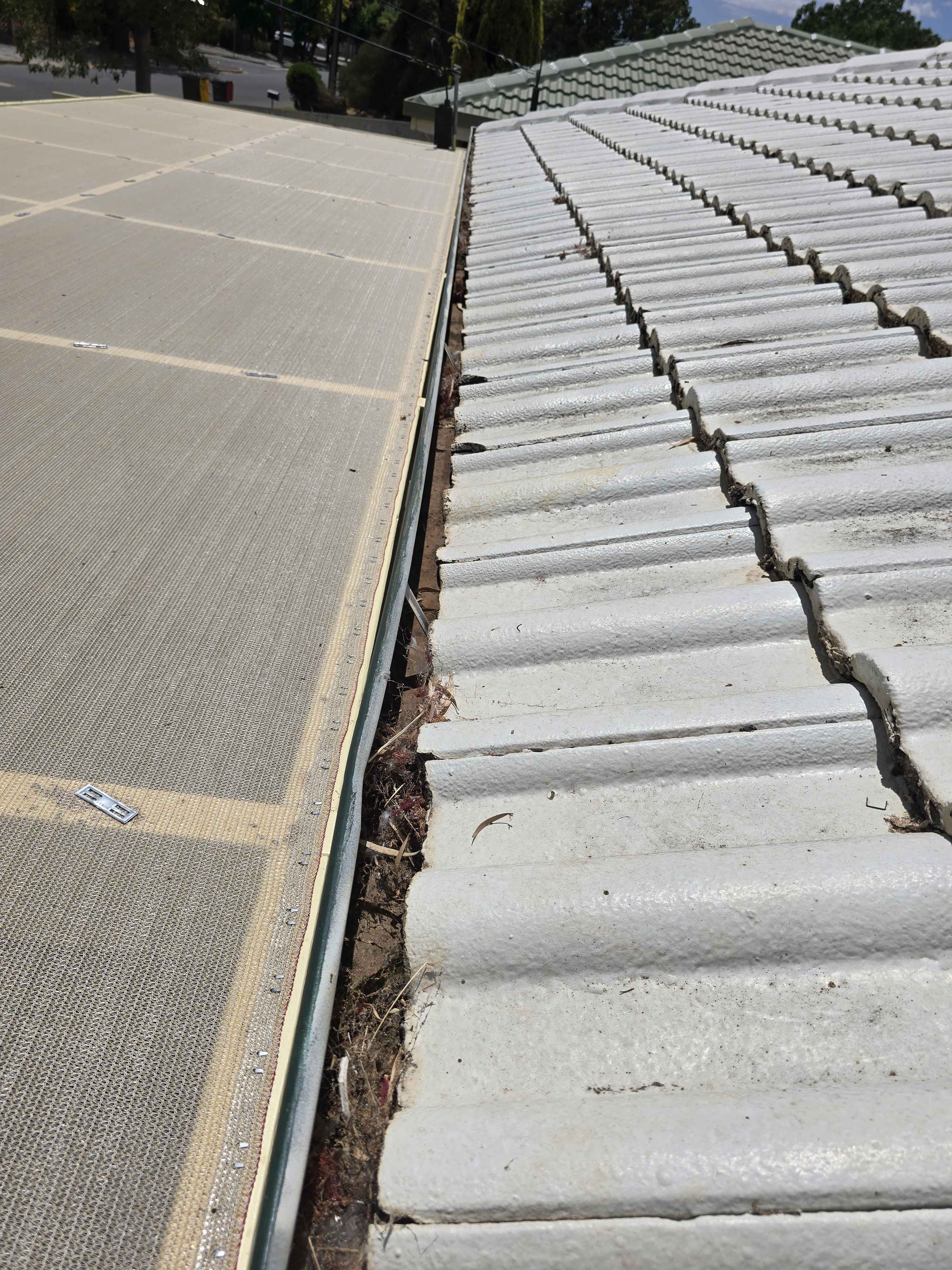 Gutter cleaning in progress